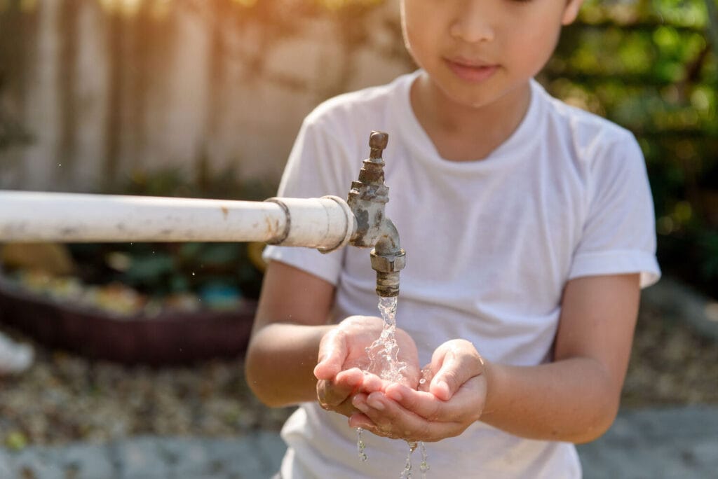 Asian girl washing hands