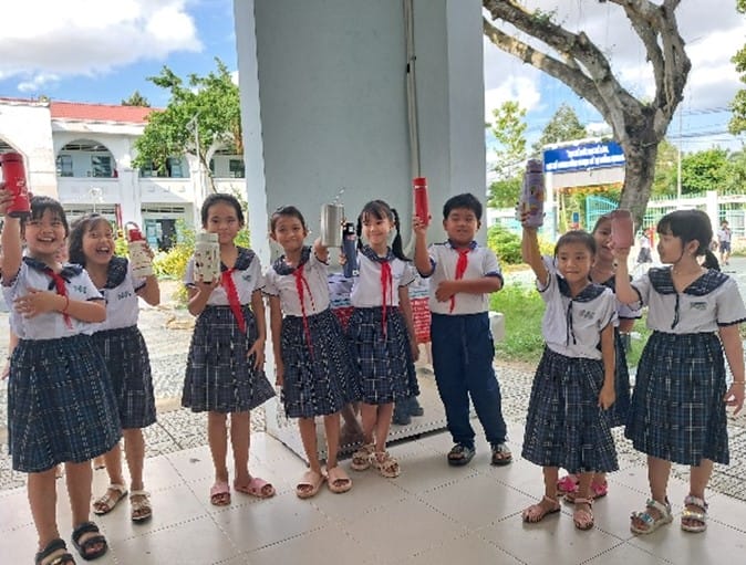 Students enjoying water during recess