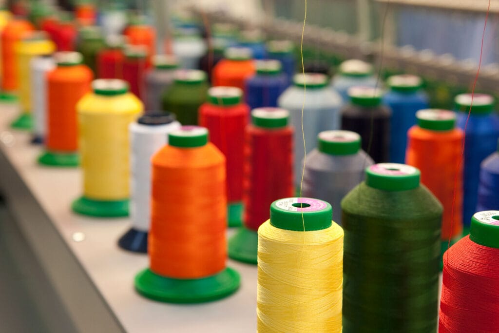 Workwear design also includes choices about fabrics, threads and other materials, such as buttons.