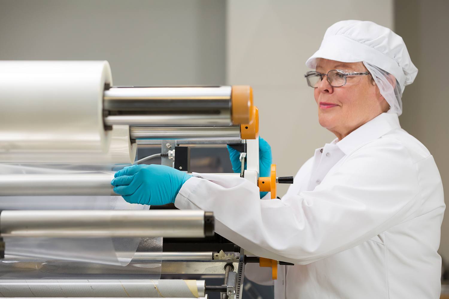 woman wearing a white catering hat at work