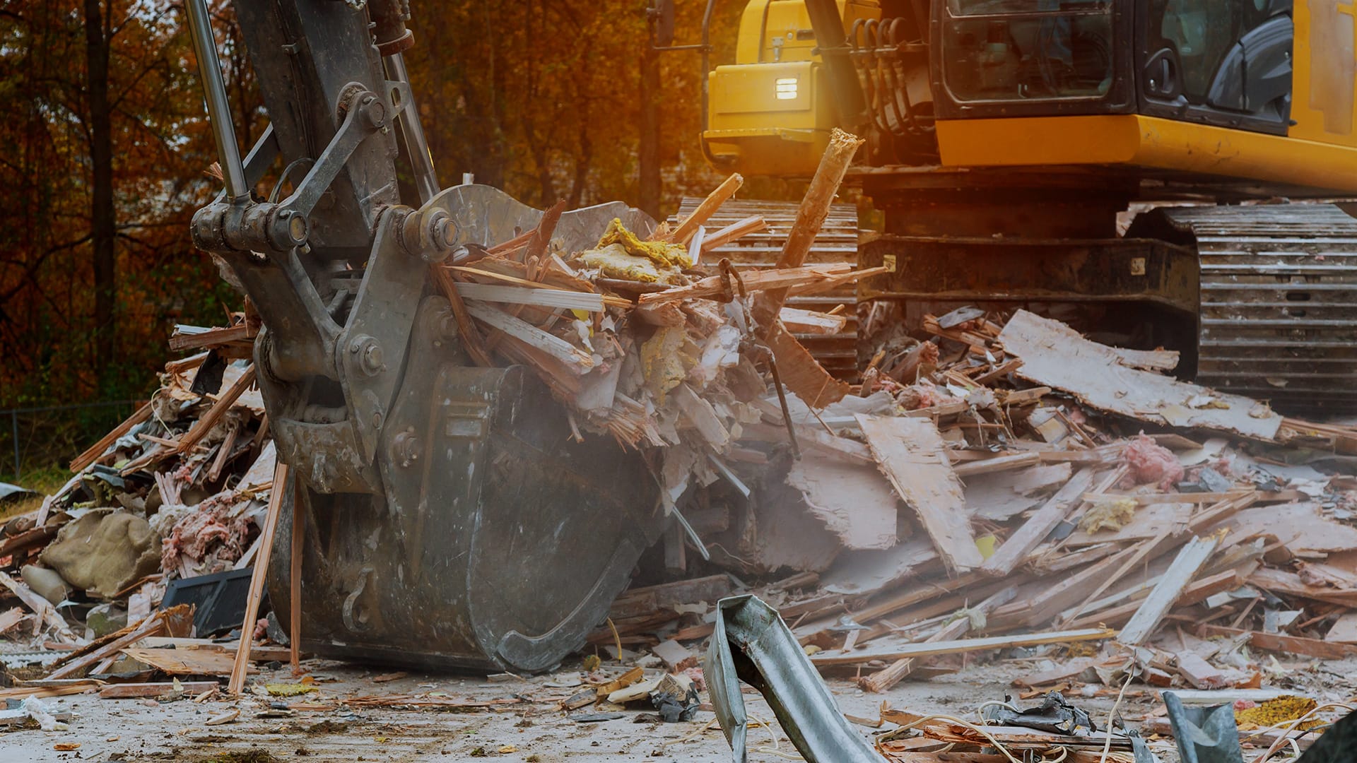 A house being demolished by excavator
