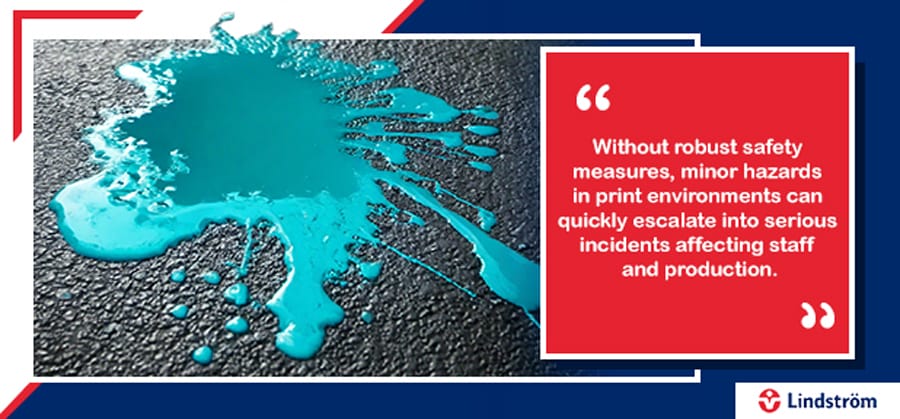 Ink spill on floor highlighting safety risks in printing environments.