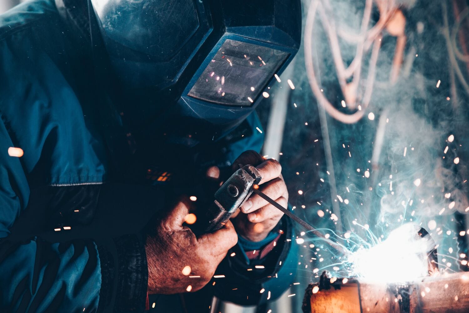 person welding wearing fire retardant clothing