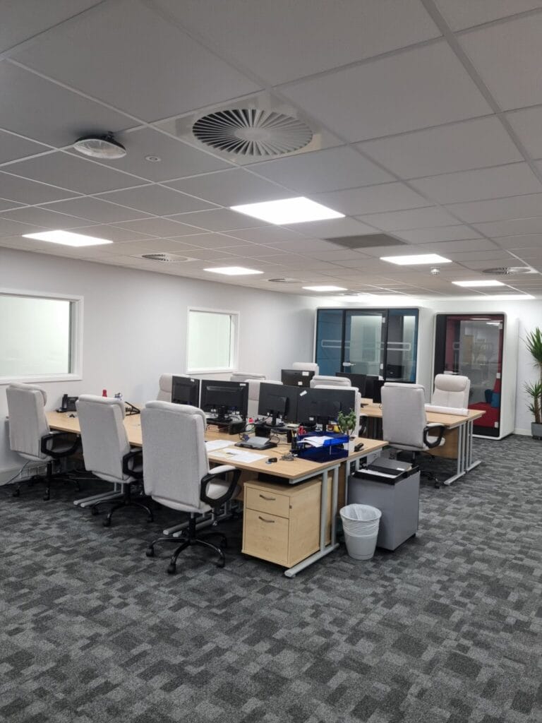 Flexible workspace pods in Lindström's refurbished Bedford office, featuring new desks and chairs.