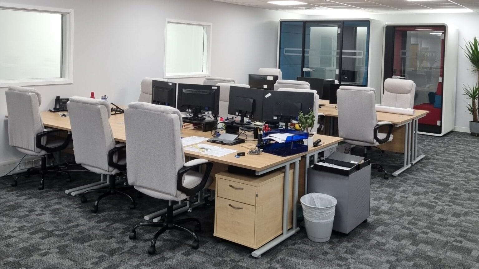 Flexible workspace pods in Lindström's refurbished Bedford office, featuring new desks and chairs.