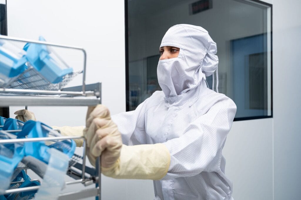 How does gowning enhance contamination control?