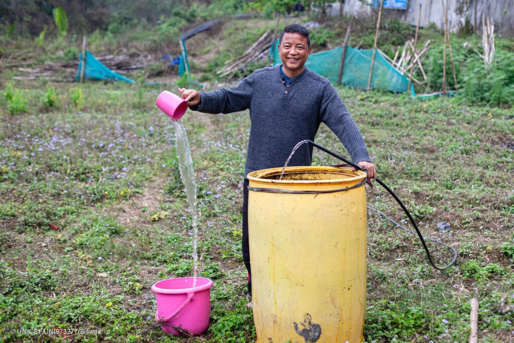 Dawa Sherpa irrigates his field with filtered grey water in Chota Mangwa, Darjeeling.